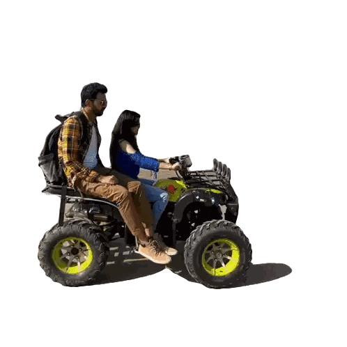 Man and Woman Riding Quad Bike