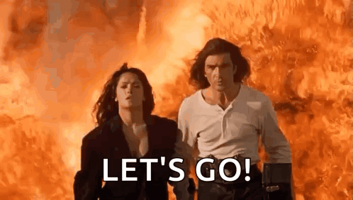 Man and Woman Running in Front of Fire Let's Go