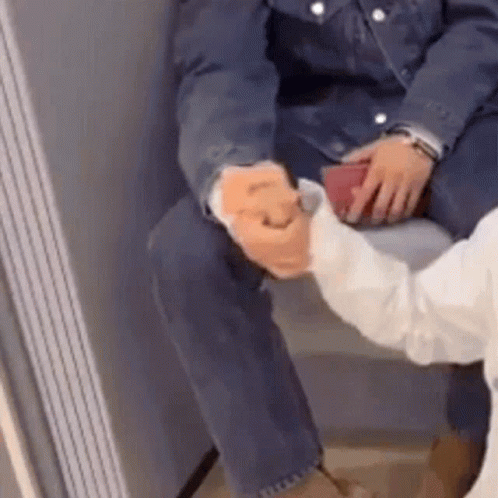 Man and Woman Shaking Hands on Bench