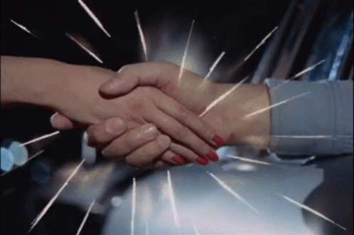 Man And Woman Shaking Hands With Sparks GIF
