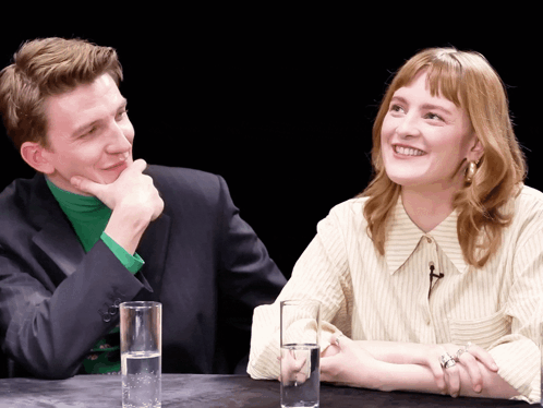 Man and Woman Sitting at Table