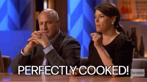 Man And Woman Sitting At Table GIF