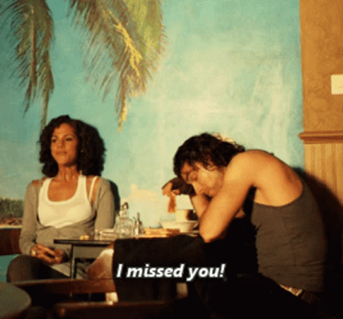 Man and Woman Sitting at Table Says I Missed You