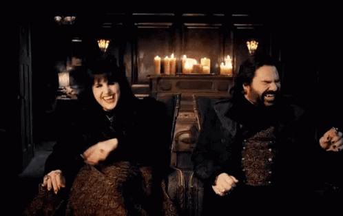 Man and Woman Sitting by Candles