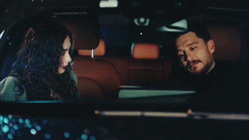 Man and Woman Sitting in Car
