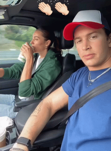 Man and Woman Sitting in Car Man Blue Shirt