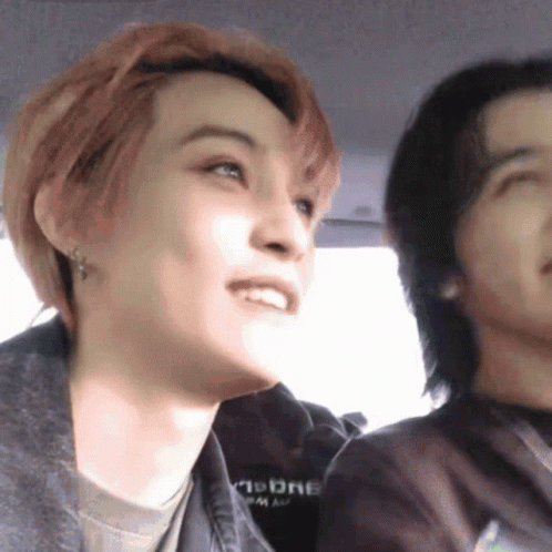 Man And Woman Sitting In Car With Moon Sweatshirt GIF
