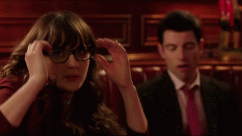Man And Woman Sitting In Dark Room GIF