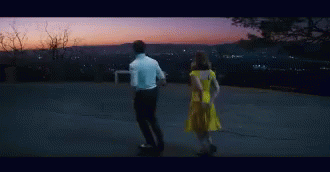 Man And Woman Sitting In Dark Room GIF