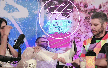 Man And Woman Sitting In Front Of After Dark Sign GIF
