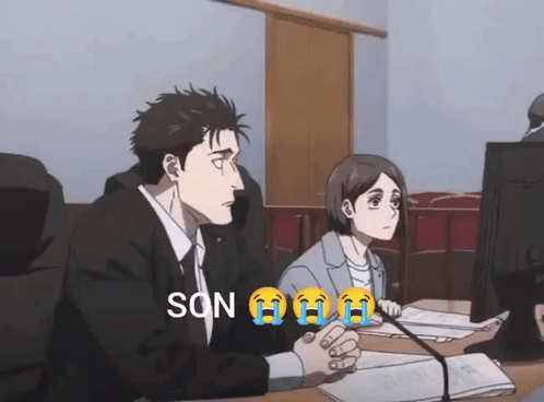 Man and Woman Sitting in Front of Computer