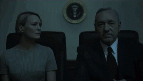 Man and Woman Sitting in Front of White House Seal