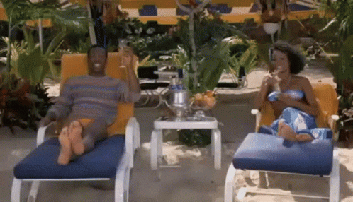 Man and Woman Sitting in Lounge Chairs
