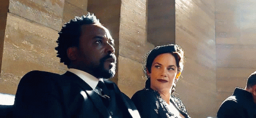 Man And Woman Sitting Next To Each Other GIF