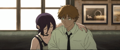 Man and Woman Sitting Next to Each Other