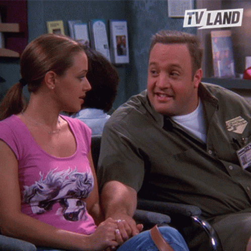 Man and Woman Sitting Next to TV Land Logo
