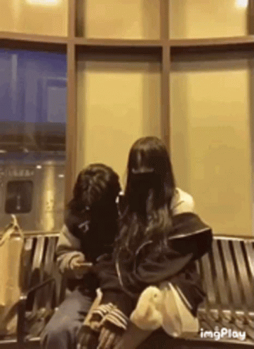 Man And Woman Sitting On Bench GIF