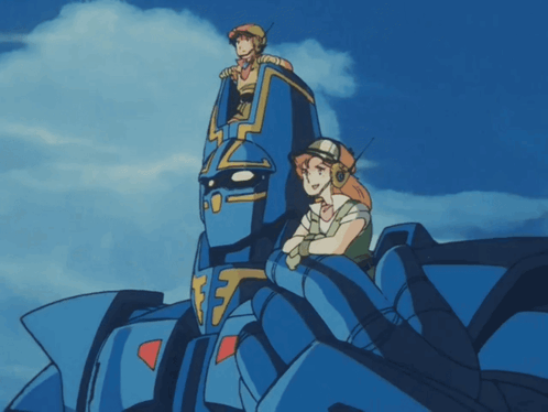 Man and Woman Sitting on Blue Robot Number 17