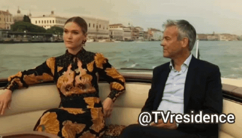 Man and Woman Sitting on Boat With @tvresidence