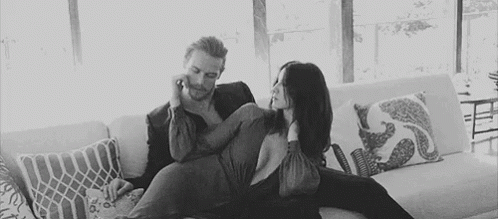 Man and Woman Sitting on Couch