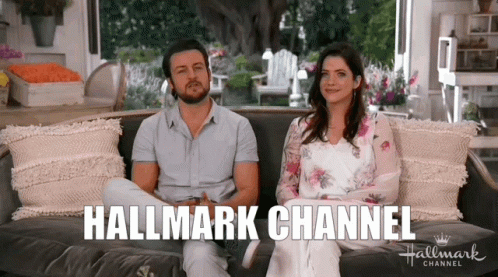 Man and Woman Sitting on Couch Hallmark Channel