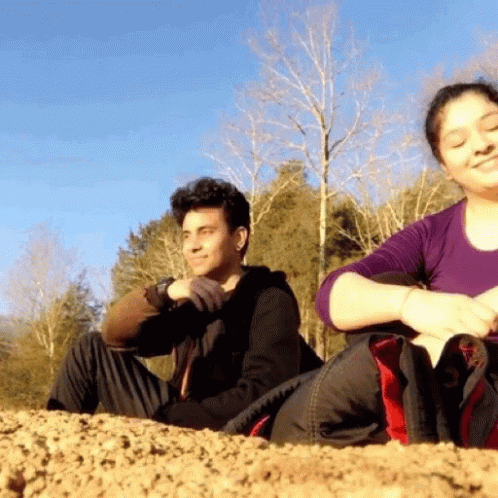 Man And Woman Sitting On Hill GIF