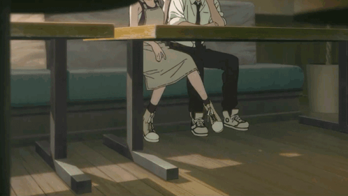 Man and Woman Sitting Together in Room