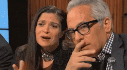 Man and Woman Sitting Woman Crying Man With Glasses