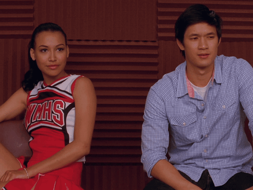 Man and Woman Sitting, Woman in WMHS Cheerleader Uniform