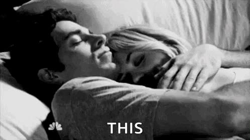 Man and Woman Sleeping in Bed