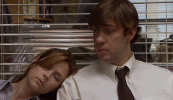 Man and Woman Sleeping in Front of Blinds