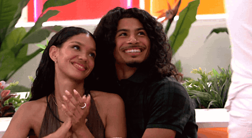Man and Woman Smiling and Clapping