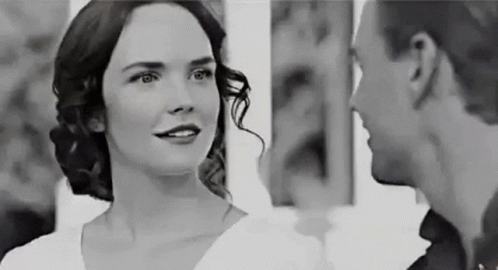 Man and Woman Smiling at Each Other