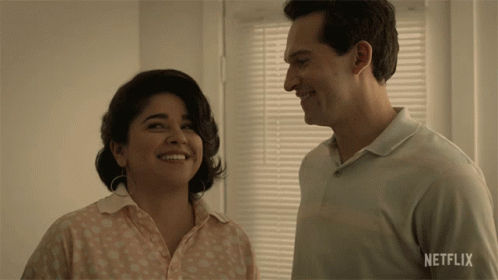 Man And Woman Smiling In Front Of Netflix Window GIF