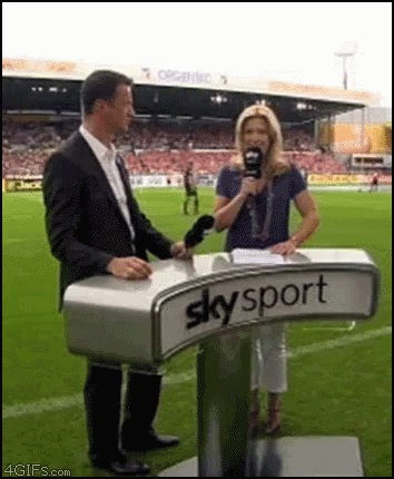 Man and Woman Standing at Skysport Podium