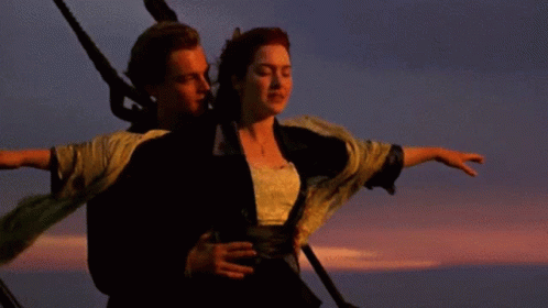 Man And Woman Standing Beside Sunset GIF