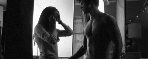 Man and Woman Standing by Window