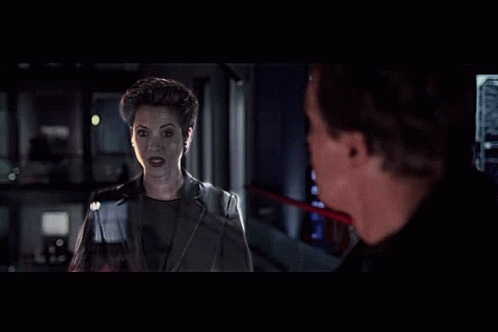 Man And Woman Standing In Dark Room GIF