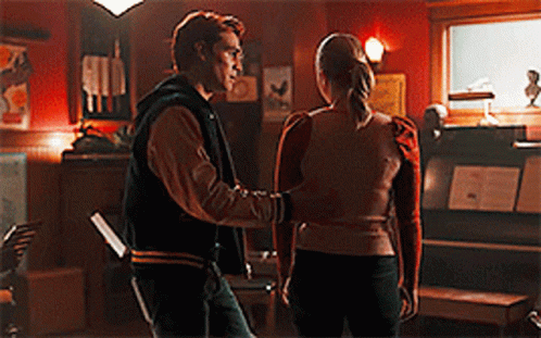 Man And Woman Standing In Dark Room GIF