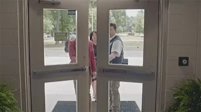 Man And Woman Standing In Doorway GIF
