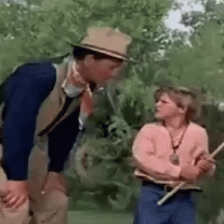 Man And Woman Standing In Field GIF