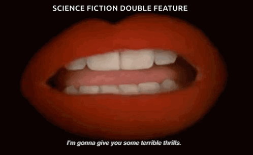 Man And Woman Standing In Front Of Candles GIF