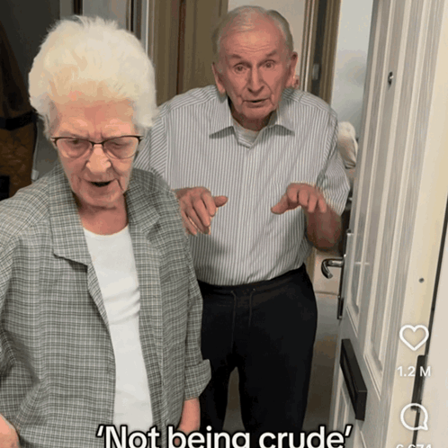 Man And Woman Standing In Front Of Door Not Being Crude