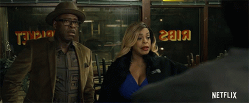 Man and Woman Standing in Front of I Know That's Right Netflix Sign
