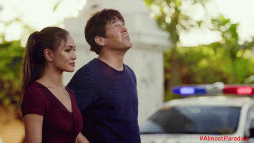Man And Woman Standing In Front Of Police Car #AlmostParadise GIF