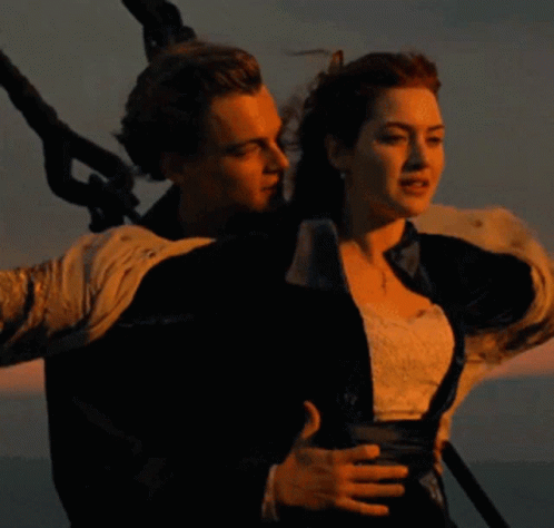 Man And Woman Standing In Ocean GIF