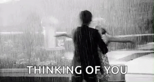 Man and Woman Standing in Rain