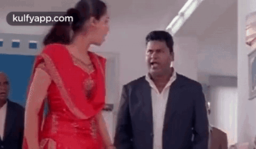 Man And Woman Standing In Room GIF