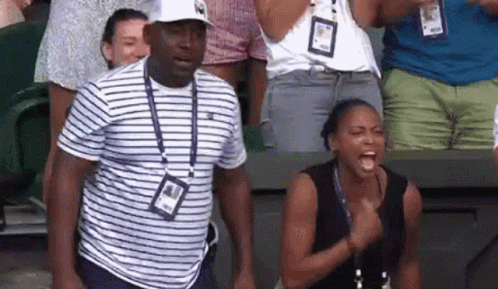 Man and Woman Standing in Stadium
