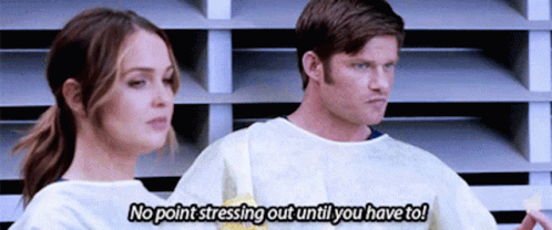 Man and Woman Standing Man Saying No Point Stressing Out Until You Have To